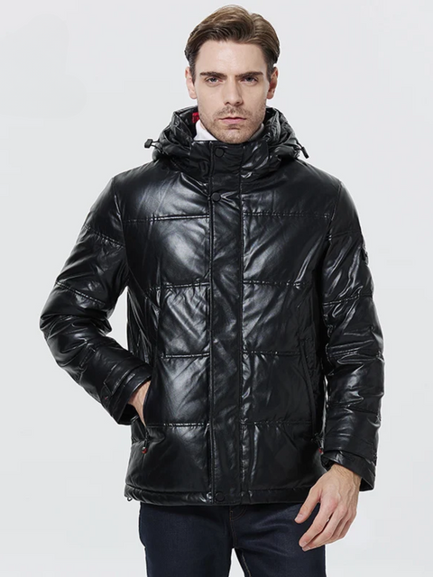 A good looking man wearing a leather jacket with thick padding, a hood, and a zipper closure.