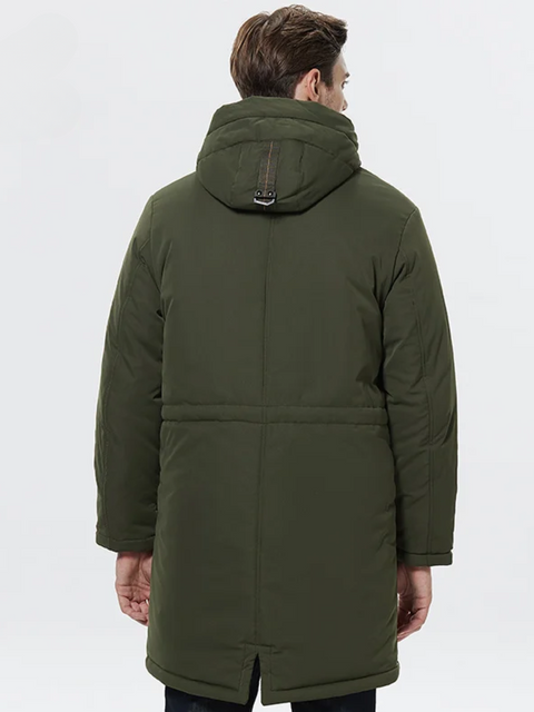 A stylish man wearing a army green jacket facing away.